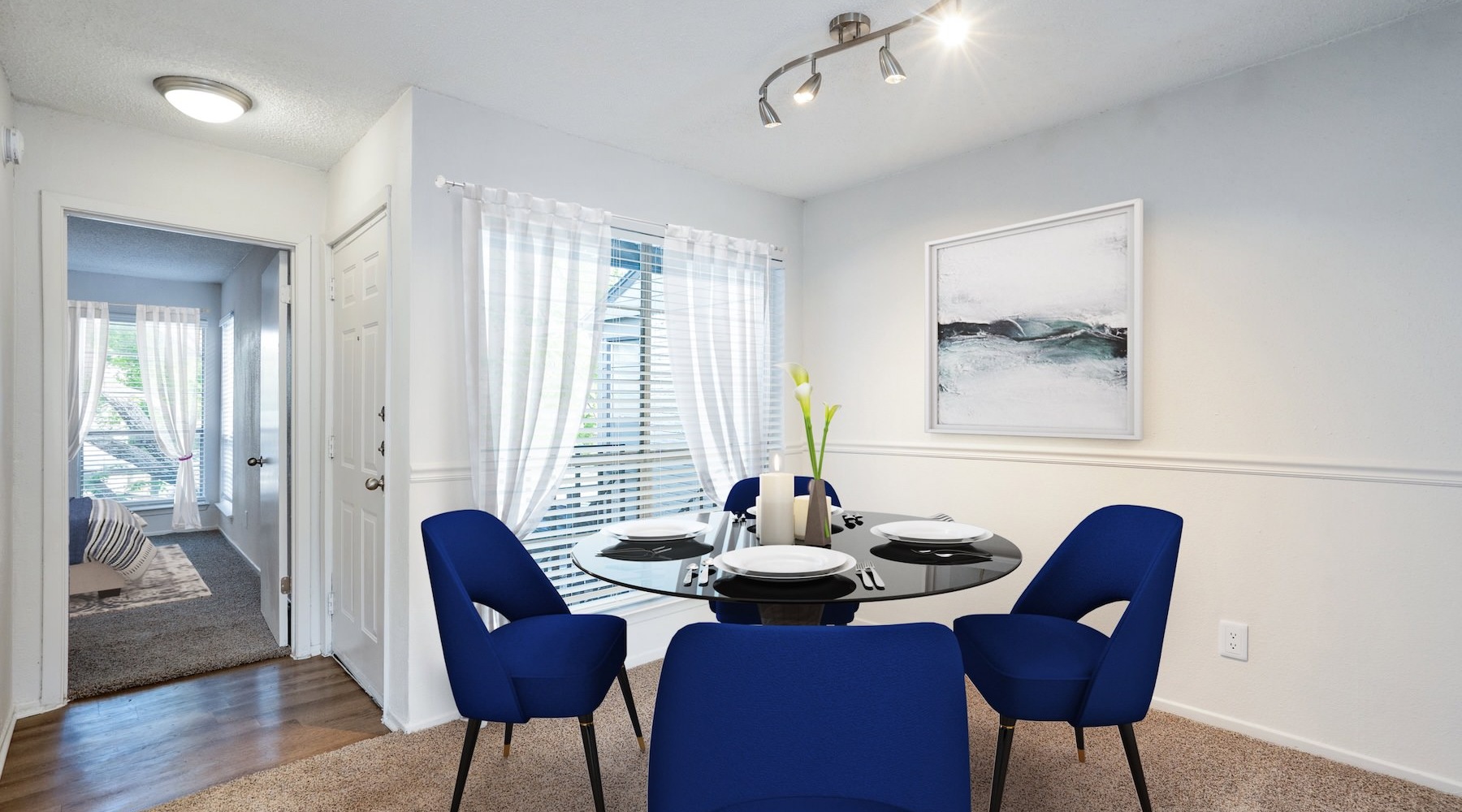 Settle into comfort at Hunters Glen a living room with blue chairs
