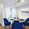 a living room with blue chairs
