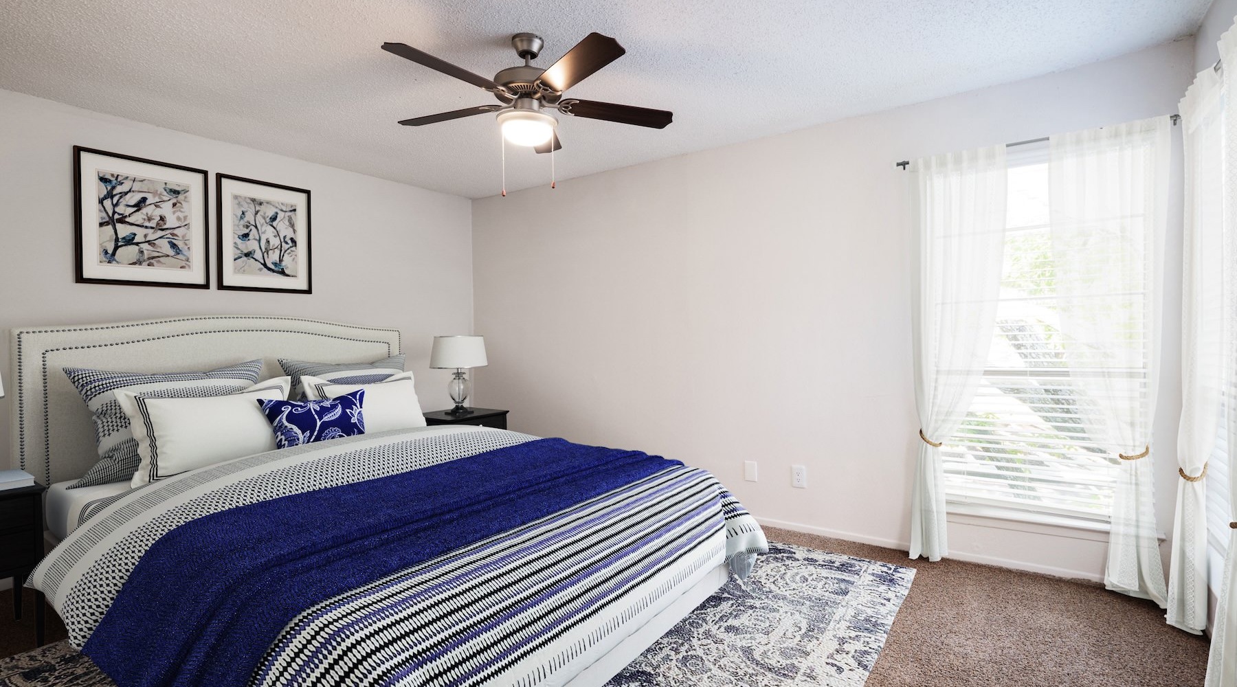 Beautiful bedrooms to fit every need a bedroom with a bed and a fan