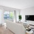 a living room with a tv and couches