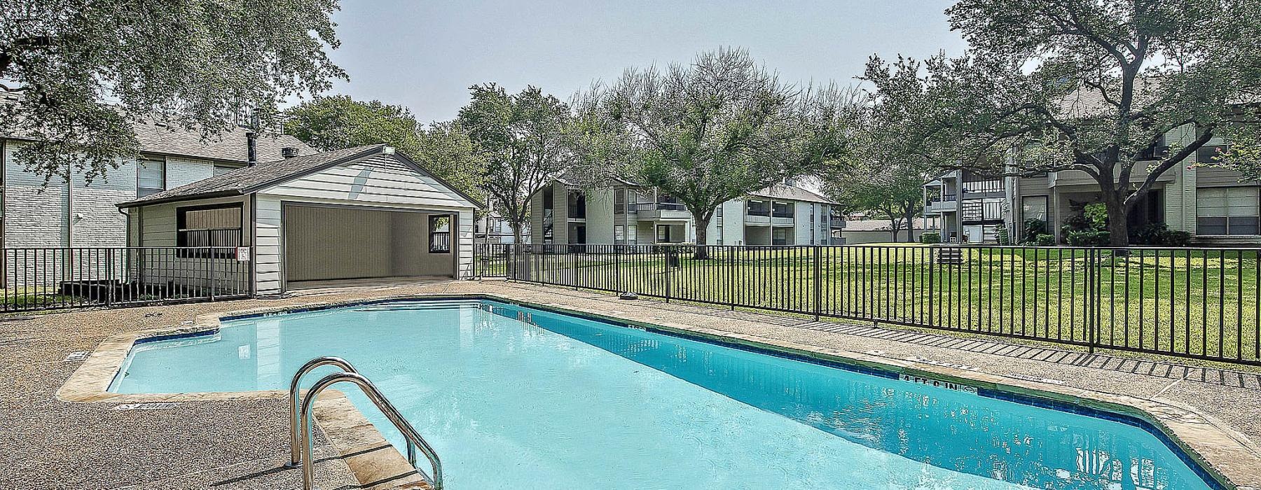 a swimming pool with a fence around it