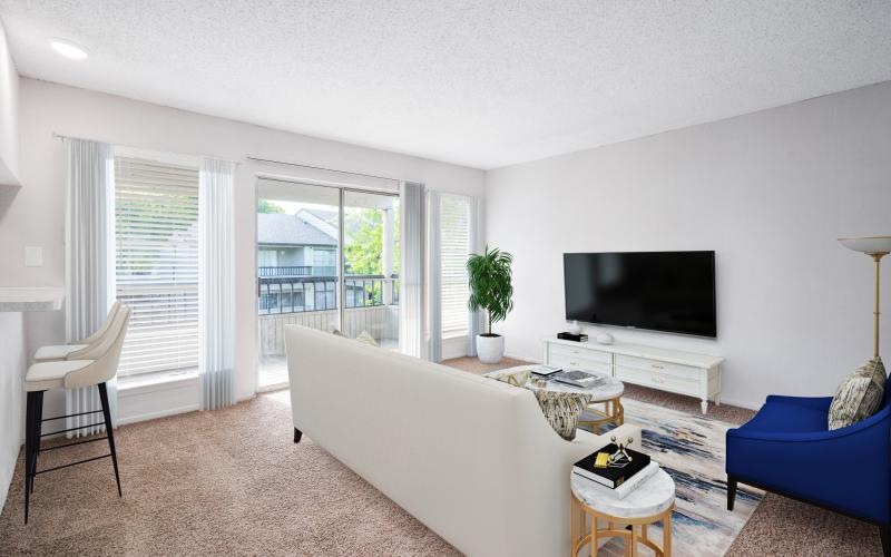 a living room with a tv and couches